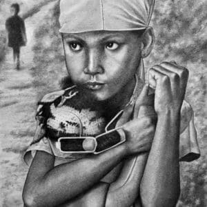 A young boy holding a baseball glove in his hands.