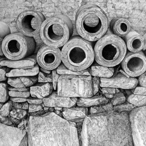 A bunch of pipes are stacked on top of each other