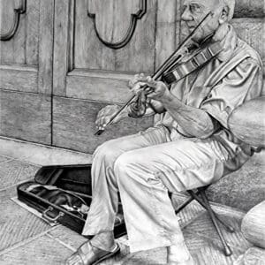 A man sitting on the ground playing an instrument.