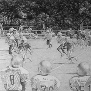 A group of young boys playing football on the field.
