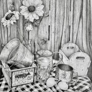 Vintage kitchen setup with rustic utensils and flowers on checkered cloth.